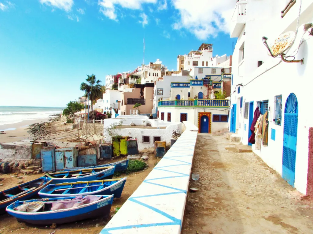 Morocco boated docked near houses and body of water